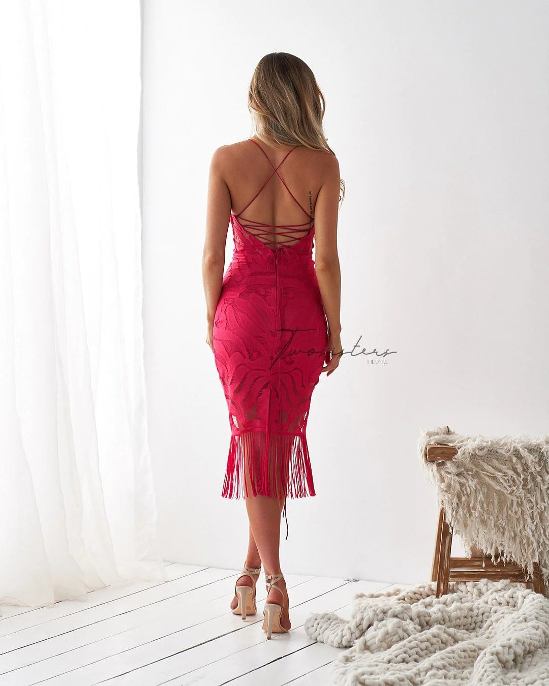 Khaleesi Dress: 
An iconic design, the Twosisters The Label Khaleesi Dress is a statement lace midi. Featuring a flattering v-neckline, lace-up back, tassel hem and finished in a st - Ciao Bella Dresses 
