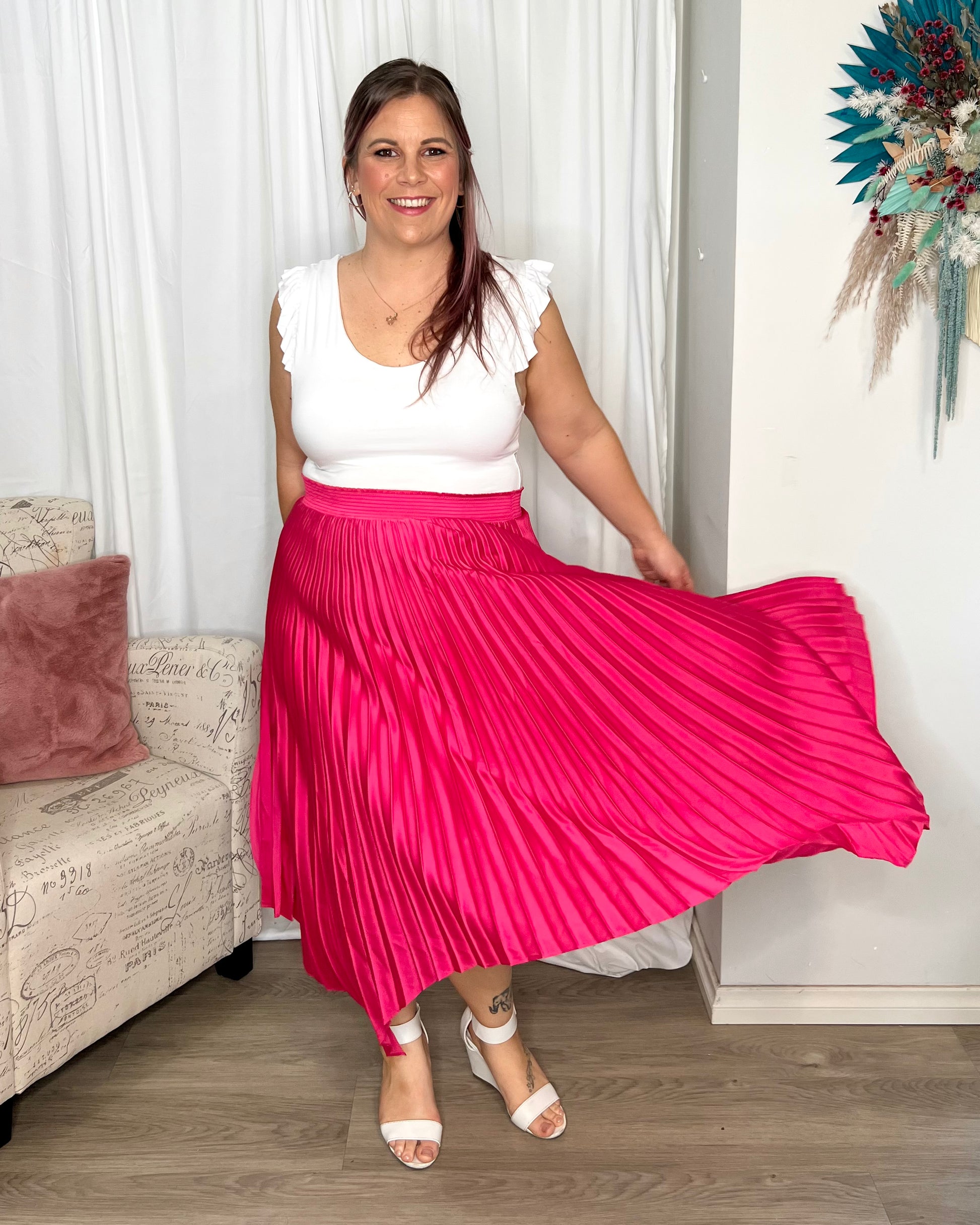 Louis Pleated Skirt | Betty Basics | Introducing the Pleated Skirt, where comfort meets playful style in the most laid-back way! With its elastic waistband, this skirt ensures a perfect fit and all-day 