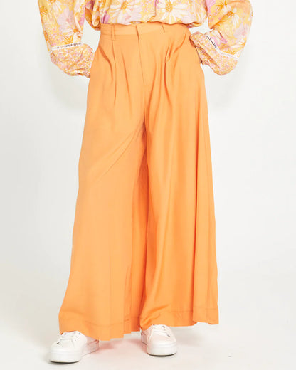 Lillian Palazzo Pants - Melon | Sass Clothing | The Lillian Palazzo Pants are a stunning shape to take you from office to after hours, year round. The pleats at the top streamline into a wide leg for the utmost in