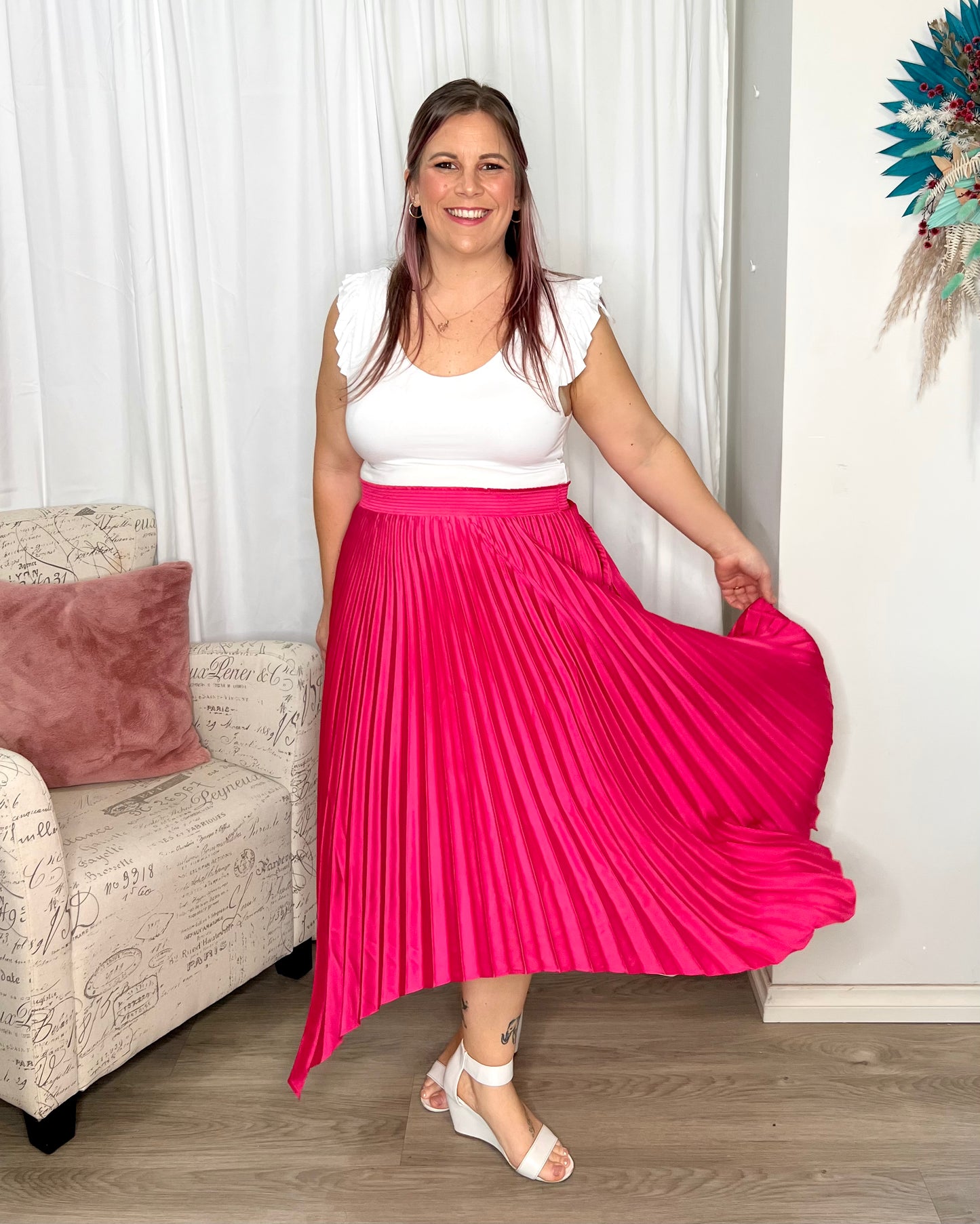 Louis Pleated Skirt: Introducing the Pleated Skirt, where comfort meets playful style in the most laid-back way! With its elastic waistband, this skirt ensures a perfect fit and all-day  - Ciao Bella Dresses - Betty Basics