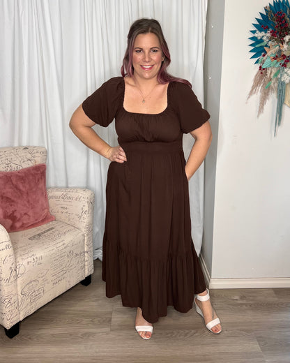 Yasmin Midi Dress - Brown | Sass Clothing | Introducing the Yasmin Frill Hem Midi Dress! With its flirty frill hem and elasticated square neckline, it exudes confidence and grace. The back shirred panel ensure