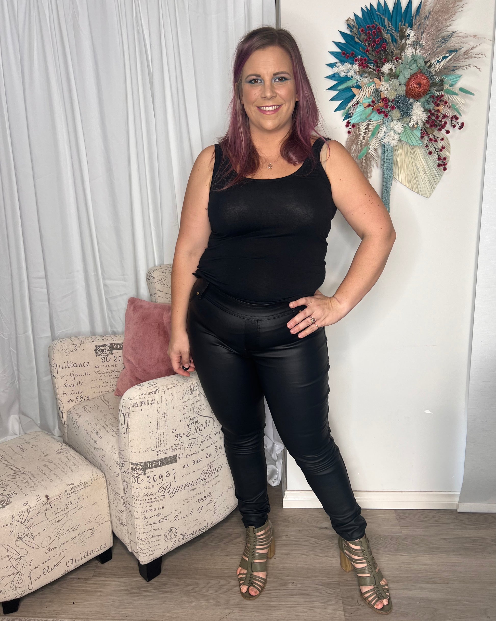Leather Look Pants: Our "leather" wet look black pants are a new season must-have. A pull-on style pant with the comfort of a jegging but with an elevated coated finish. Style with a si - Ciao Bella Dresses 