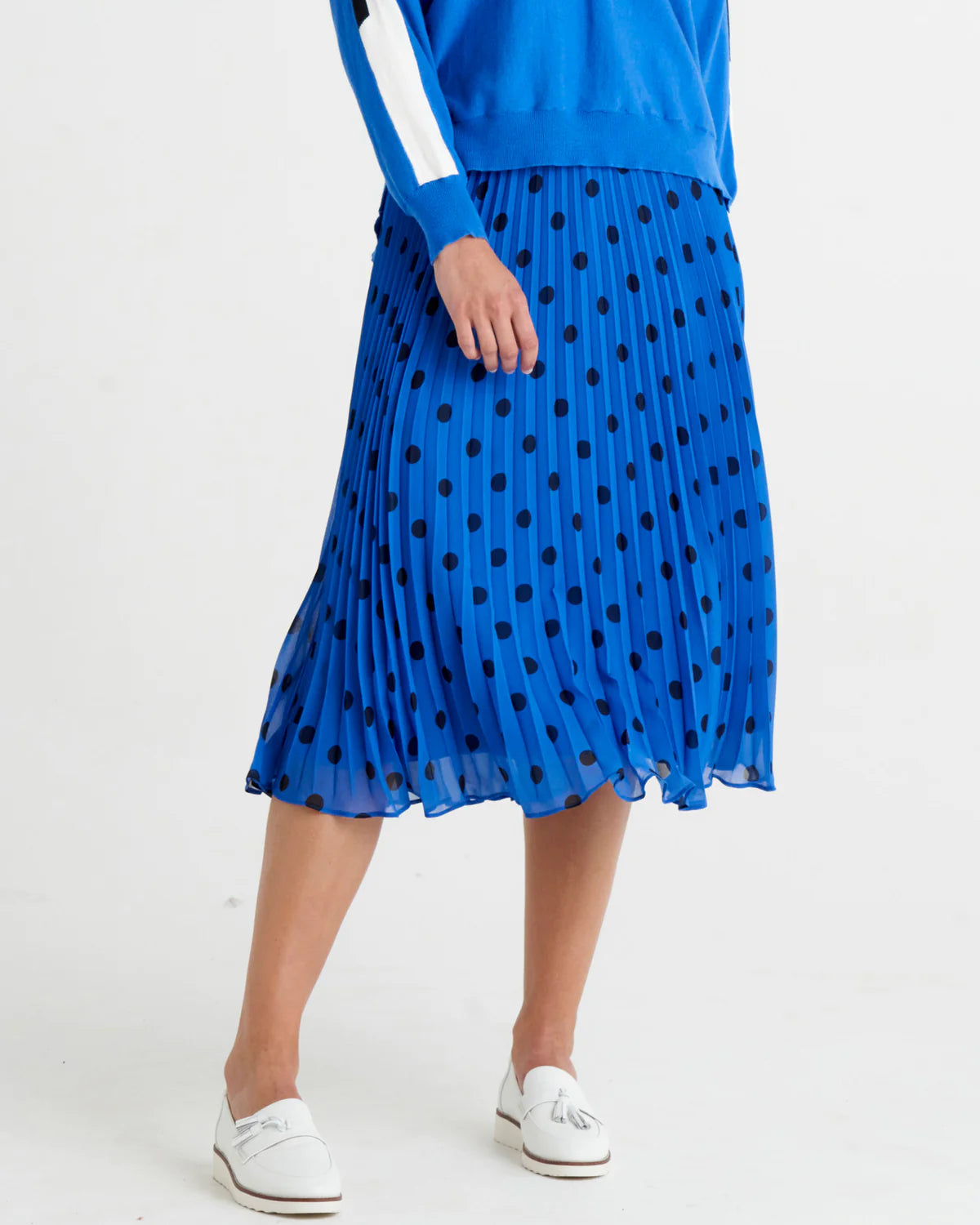 Chanell Pleated Skirt | Betty Basics | 
Introducing the Chanel Pleated Skirt, the epitome of fun and laid-back style! With its elastic waistband, this skirt ensures a comfortable and perfect fit for all-d