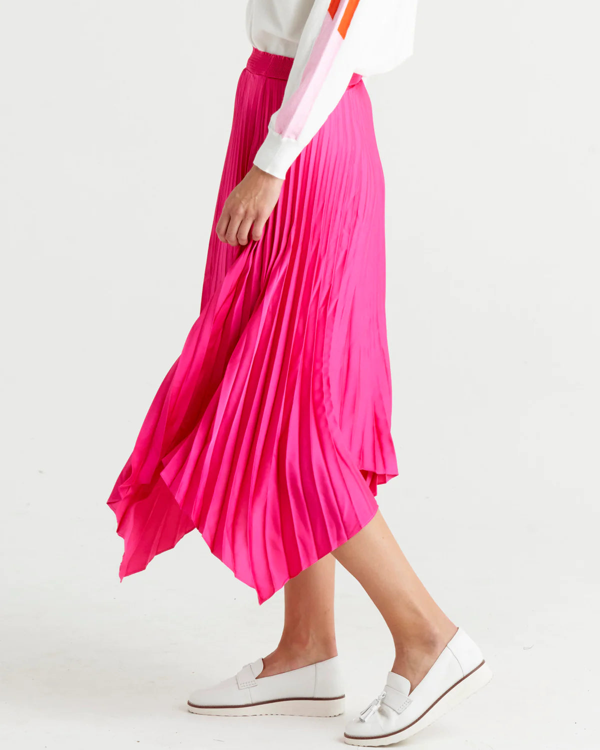 Louis Pleated Skirt | Betty Basics | Introducing the Pleated Skirt, where comfort meets playful style in the most laid-back way! With its elastic waistband, this skirt ensures a perfect fit and all-day 