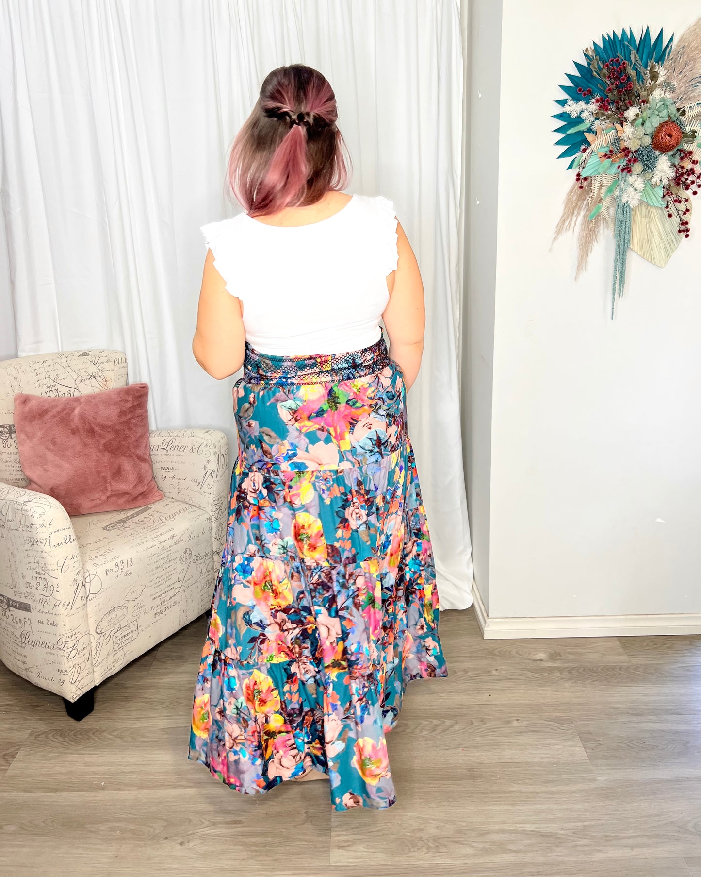 Pure Shores Shirred Boho Skir | Fate + Becker | Introducing the Pure Shores Shirred Boho Skirt, a stunning embodiment of elegance and versatility. Adorned with a gorgeous teal bouquet pattern, this skirt is a true