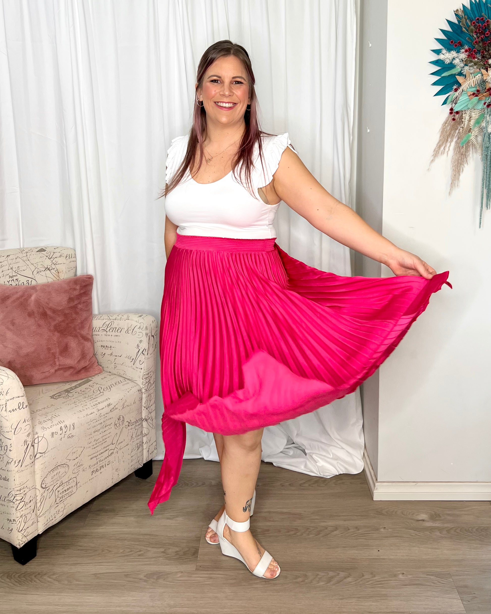 Louis Pleated Skirt: Introducing the Pleated Skirt, where comfort meets playful style in the most laid-back way! With its elastic waistband, this skirt ensures a perfect fit and all-day  - Ciao Bella Dresses - Betty Basics