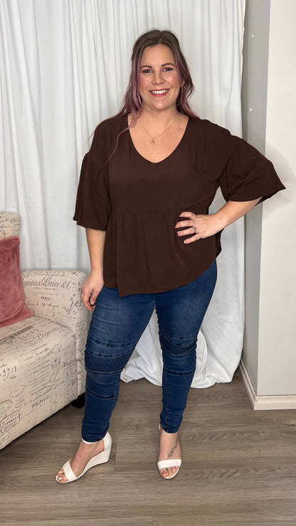 Yasmin Bubble Sleeve Top - Brown | Sass Clothing |  
With its trendy V-neckline and dropped shoulder into bubble sleeves, this top exudes effortless style. The relaxed fit offers ultimate comfort, while the back keyh