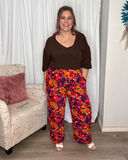 Yasmin Floral Wide Leg Pant:  
Introducing the Yasmin Wide Leg Pant - where comfort meets style in perfect harmony! With its flat front and elasticated back waist, these pants offer a flattering - Ciao Bella Dresses - Sass Clothing