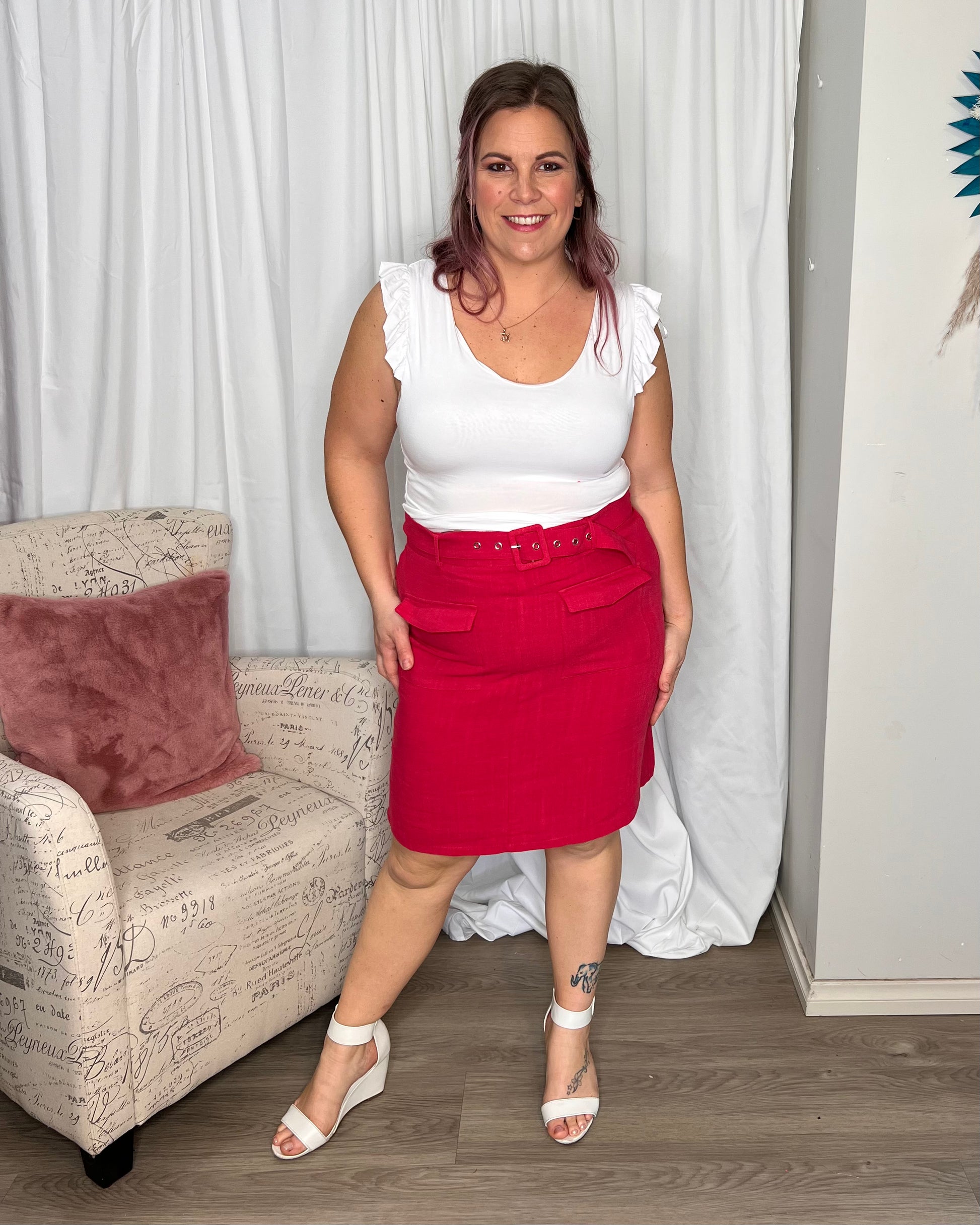 Roxanne Belted Mini Skirt:  
Introducing the Roxanne Belted Straight Silhouette - where style and functionality meet! With its classic straight silhouette, this dress offers a timeless and fla - Ciao Bella Dresses - Sass Clothing