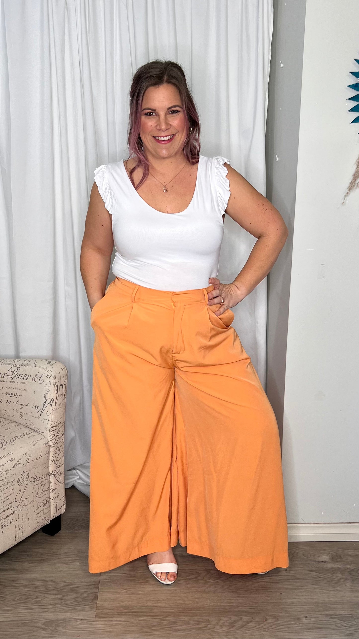 Lillian Palazzo Pants - Melon | Sass Clothing | The Lillian Palazzo Pants are a stunning shape to take you from office to after hours, year round. The pleats at the top streamline into a wide leg for the utmost in