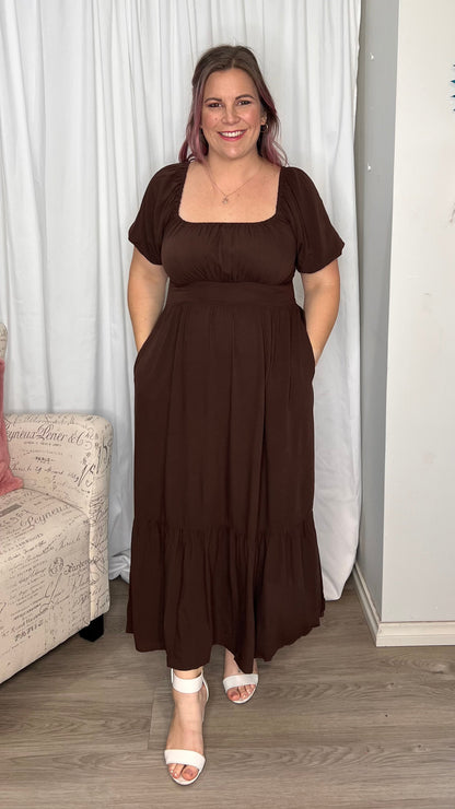 Yasmin Midi Dress - Brown | Sass Clothing | Introducing the Yasmin Frill Hem Midi Dress! With its flirty frill hem and elasticated square neckline, it exudes confidence and grace. The back shirred panel ensure