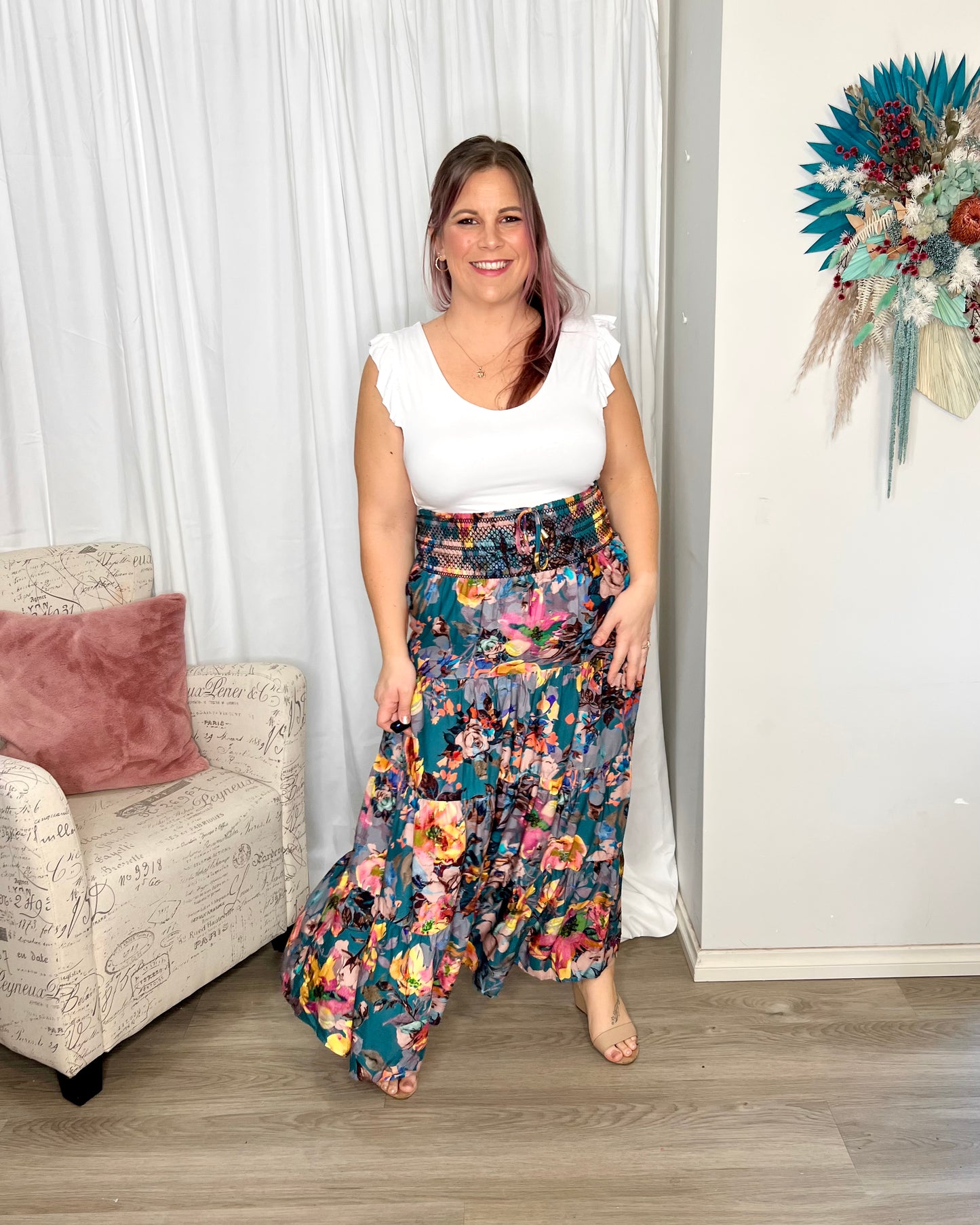 Pure Shores Shirred Boho Skir | Fate + Becker | Introducing the Pure Shores Shirred Boho Skirt, a stunning embodiment of elegance and versatility. Adorned with a gorgeous teal bouquet pattern, this skirt is a true