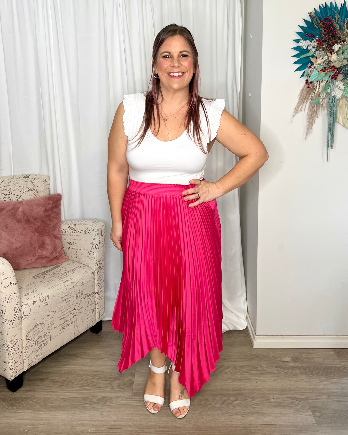 Louis Pleated Skirt: Introducing the Pleated Skirt, where comfort meets playful style in the most laid-back way! With its elastic waistband, this skirt ensures a perfect fit and all-day  - Ciao Bella Dresses - Betty Basics