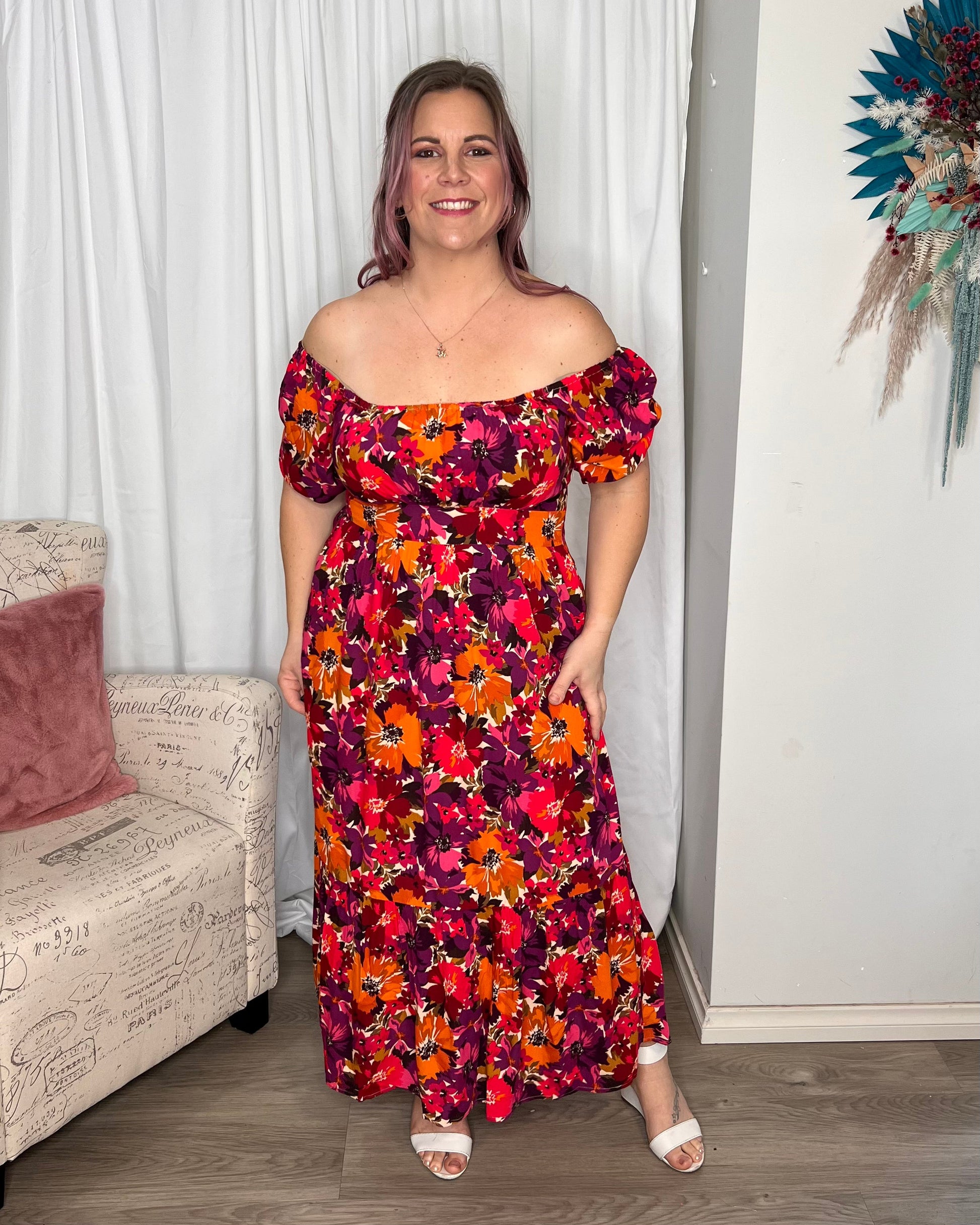 Yasmin Midi Dress - Berry Floral | Sass Clothing | Introducing the Yasmin Frill Hem Midi Dress! With its flirty frill hem and elasticated square neckline, it exudes confidence and grace. The back shirred panel ensure