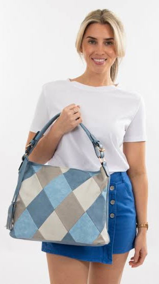 Harley Quin Shoulder Bag | Sassy Duck | Eye catching patchwork, diamond shaped front-pattern with double tassel. Soft gold hardware attaches shoulder handles and crossbody handle
Features: 

Dark interior 