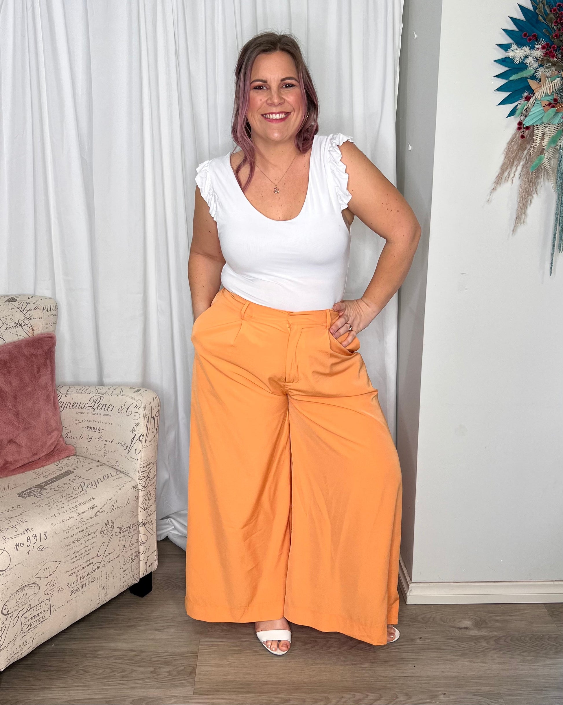 Lillian Palazzo Pants - Melon | Sass Clothing | The Lillian Palazzo Pants are a stunning shape to take you from office to after hours, year round. The pleats at the top streamline into a wide leg for the utmost in