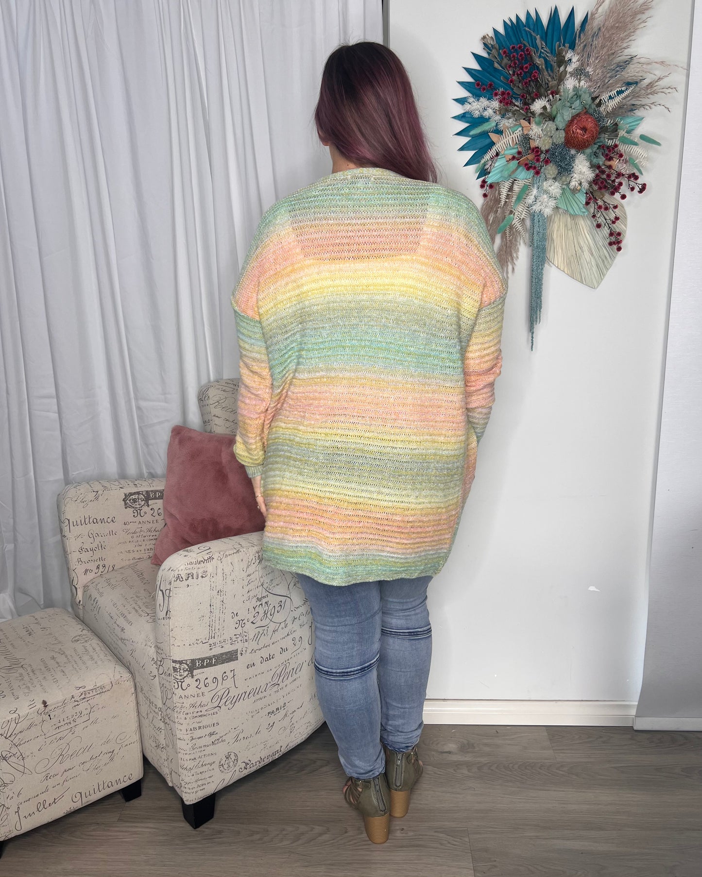 Delilah Rainbow Knit Cardigan: Delilah Rainbow Knit Cardigan is a vibrant and cheerful addition to any wardrobe! The unique and colorful design is sure to turn heads and make you feel like a ray o - Ciao Bella Dresses 