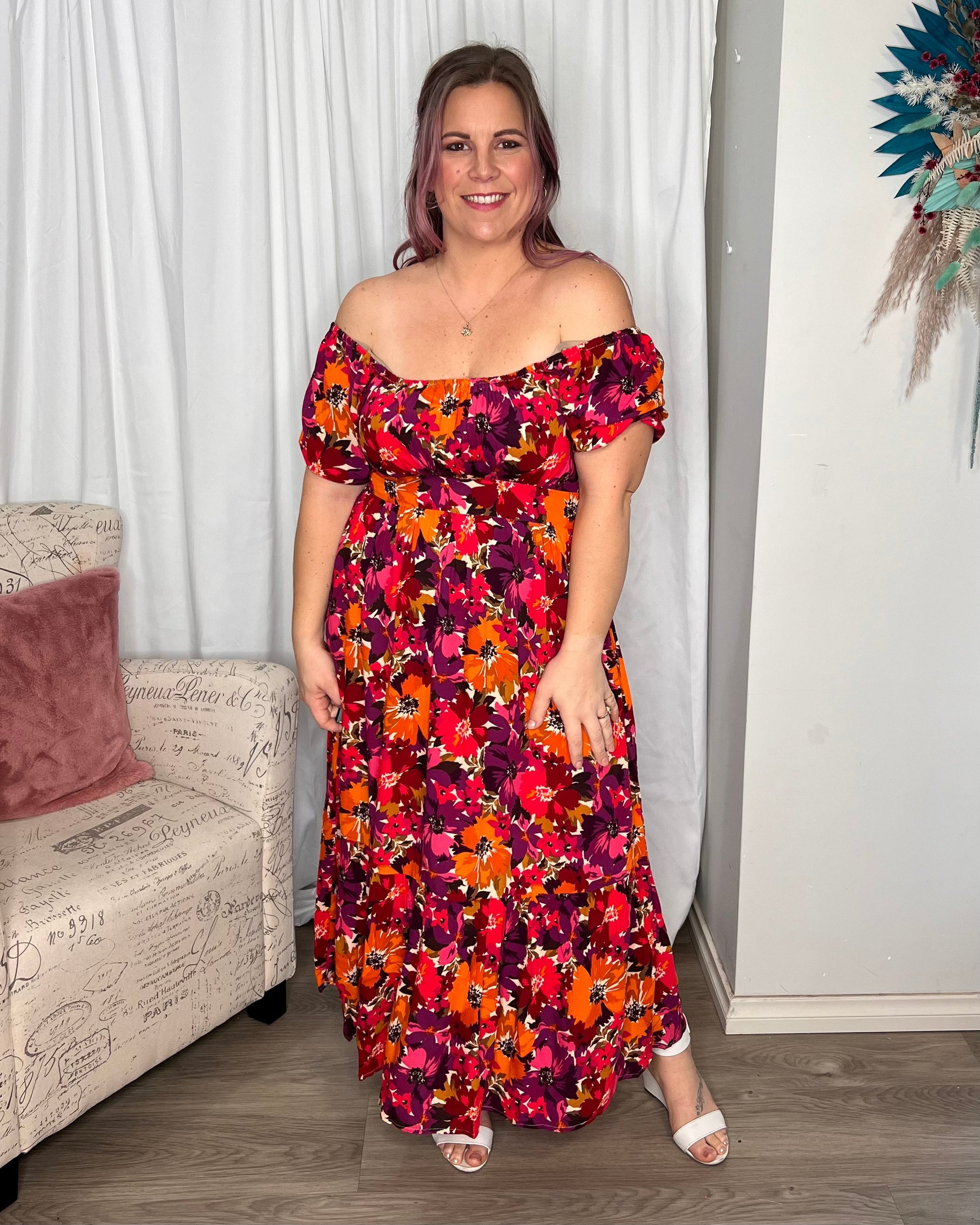 Yasmin Midi Dress - Berry Floral | Sass Clothing | Introducing the Yasmin Frill Hem Midi Dress! With its flirty frill hem and elasticated square neckline, it exudes confidence and grace. The back shirred panel ensure