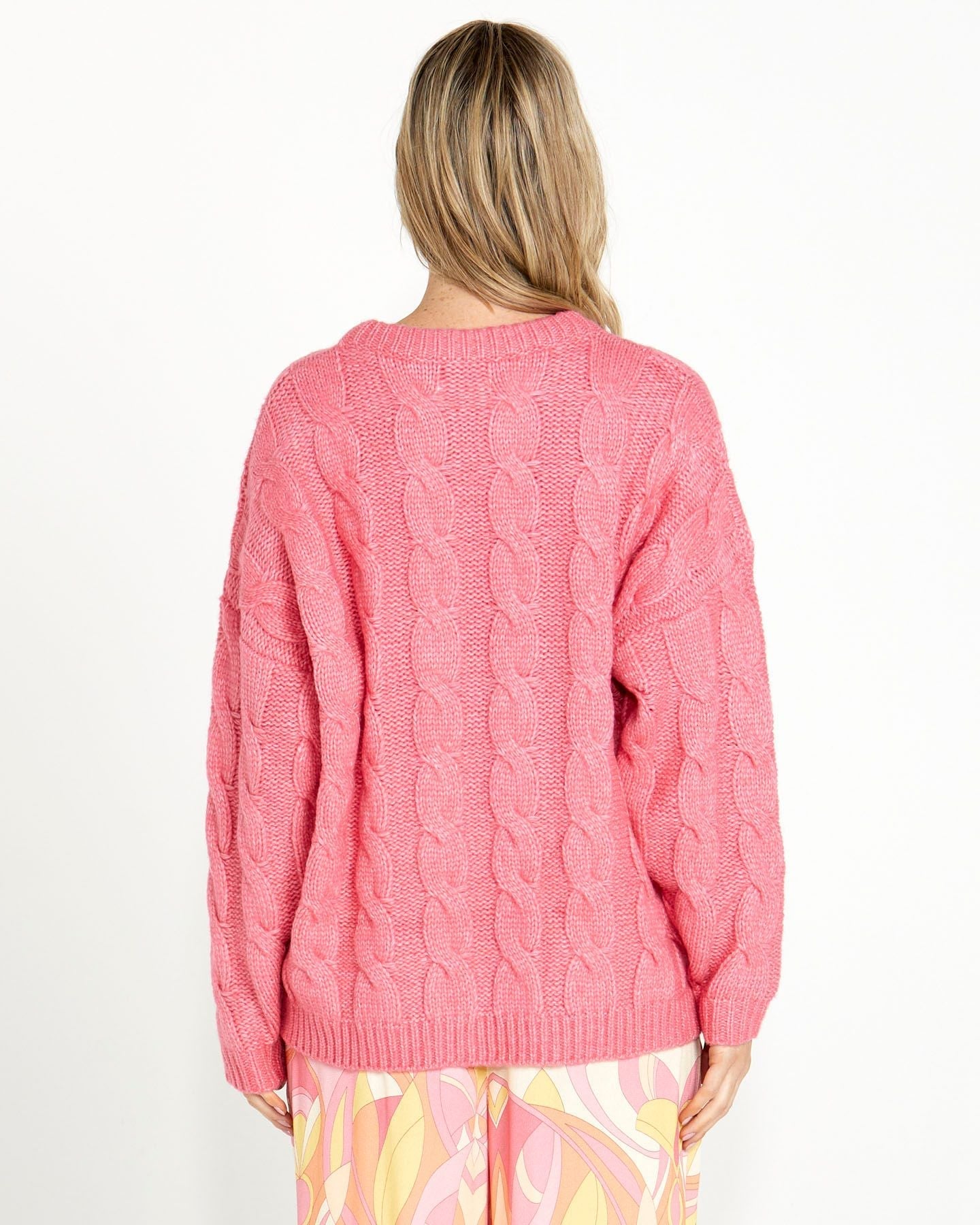 Felicity Cable Knit Jumper - Pink | Sass Clothing | This winter cable knit is brings a pop of colour to your winter wardrobe. It comes in pink or purple. Perfect for cold weather, this top features classic cable knit 