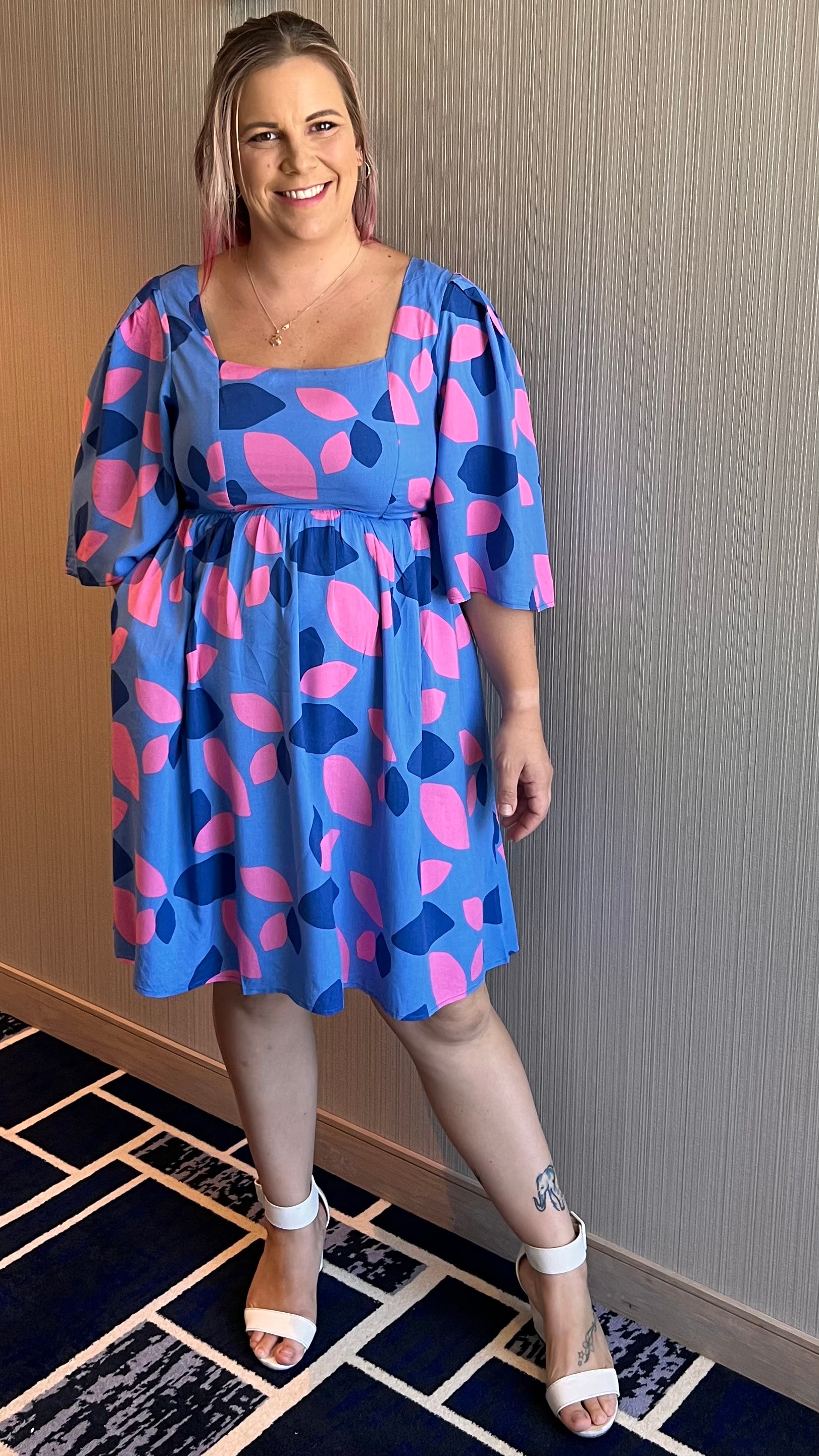 Amora Flute Sleeve Dress: The Amora Dress features a super cute pink and blue spotted design. It has gorgeous fluted sleeves and POCKETS
Features:

Shirred back
Mid length fluted sleeves
Pock - Ciao Bella Dresses 