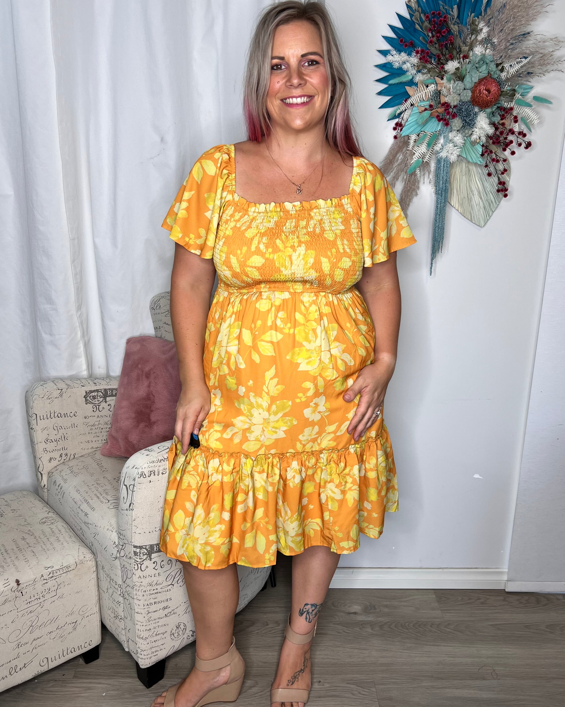 Maya Dress - Sunrise: Shine like a ray of sunshine in the Maya Dress. This sweet little number has sleeves that can be worn on or off the shoulder and a shirred bust, giving it a gorgeous - Ciao Bella Dresses 