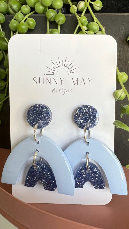 Sunny May Bold Earrings - Happy Rainbow | Sunny May Designs | These earrings are handmade from a delightful mix of colours and glitter, creating the perfect mix of vibrant colour and shine
They feature various coloured jump rin