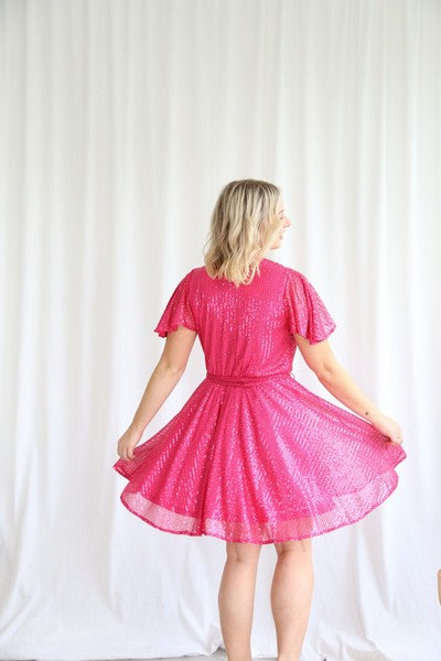 Myria Sequin Dress - Hot Pink | Roseason | Myria is here and ready to party! This sequin number is a fun and flirty mini dress, perfect for dancing the night away

Bra friendly
Pull aside breastfeeding access