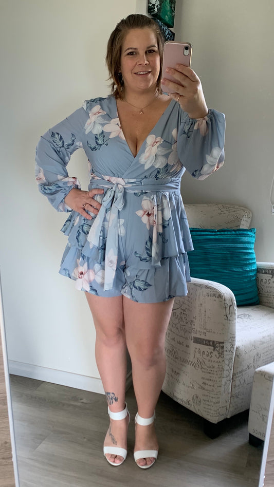 Daphne Playsuit - Blue/Grey Floral | Style State | 
Polyester
Printed fabrication
V-neckline design
Bubble sleeves
Elastic detailing around cuff
Self-fabric belt tie on front
Waist seam panel for flattering fit
Featu