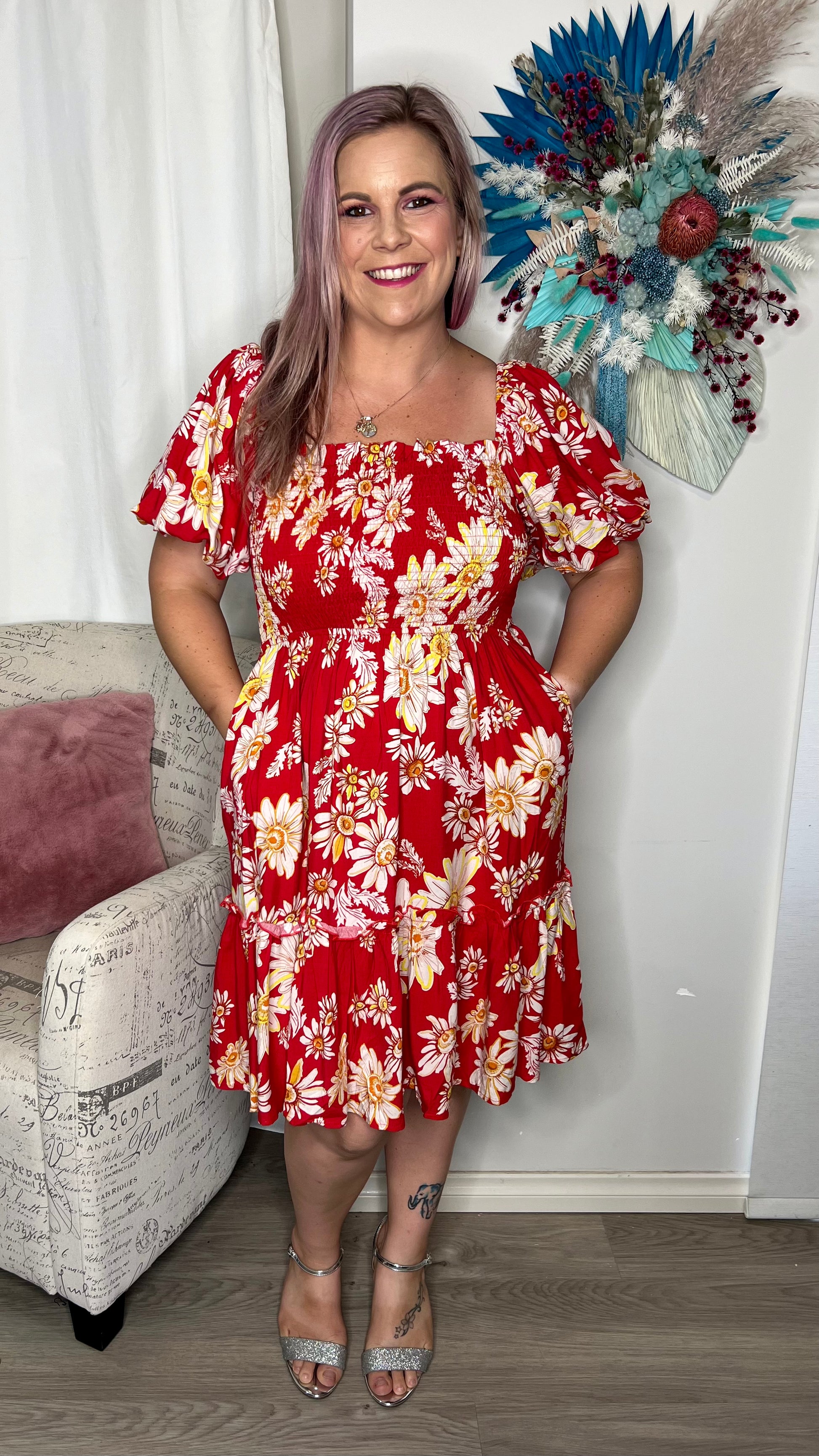 Ruby Dress - Red Floral: The Ruby dress is a super cute mini with gorgeous puff sleeves, giving it a beautiful shape

Shirred bodice
Elasticated sleeves
Mini length
Pockets
True to size
Dani - Ciao Bella Dresses 