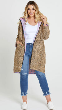 Tasha Reversible Puffer Jacket | Sass Clothing | Introducing the Tasha Puffer Reversible Jacket, the ultimate statement piece for your winter wardrobe. Featuring a groovy psychedelic print on one side and leopard p