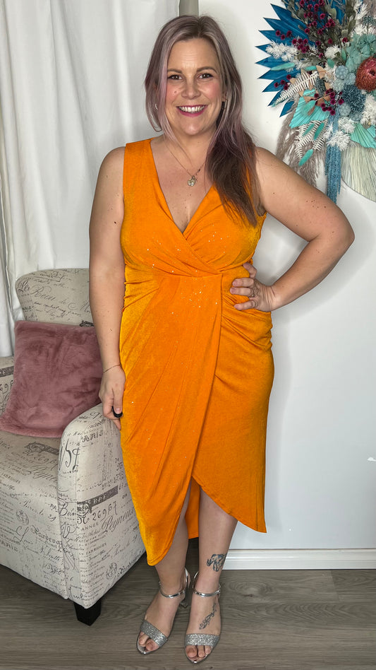 Kyan Glitter Dress - Tangerine | Spicy Sugar | 
Polyester / elastane 
True to size - if between sizes, size down
Danika is wearing a size 12
Lots of stretch with zip up back
Pull aside for breastfeeding access 

