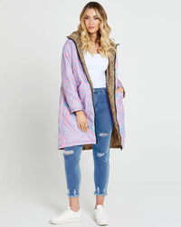 Tasha Reversible Puffer Jacket | Sass Clothing | Introducing the Tasha Puffer Reversible Jacket, the ultimate statement piece for your winter wardrobe. Featuring a groovy psychedelic print on one side and leopard p