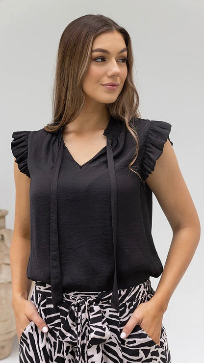 Jasmine Top - Black: 

Meet the elegant Bee Maddison Jasmine Top in black. Detailed with a sweet frill  around the sleeve and neck. The flattering neckline features a tie that can be lef - Ciao Bella Dresses 