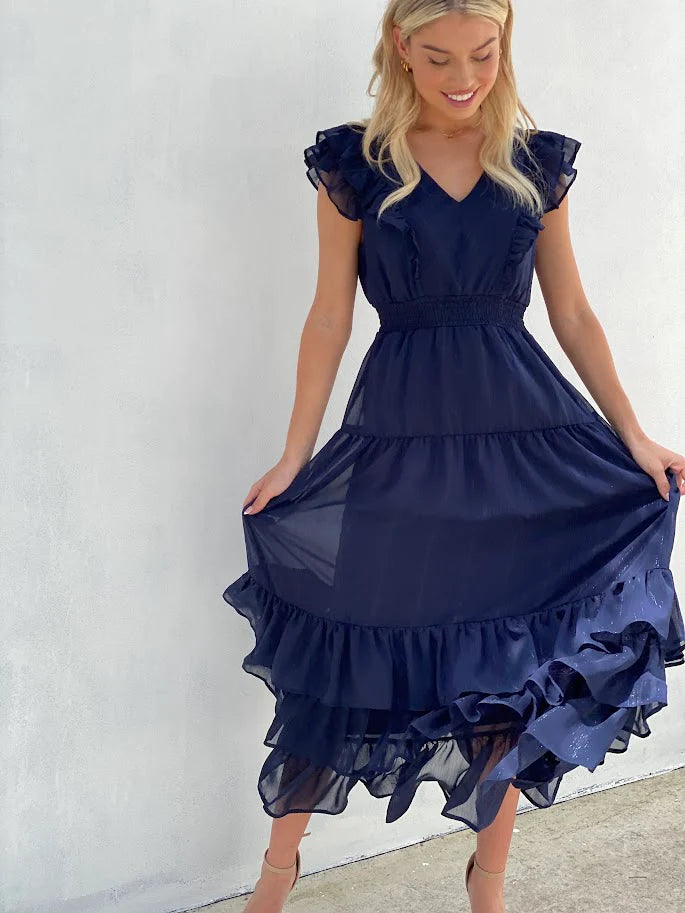 Diana Ruffle Dress: Be the centre of attention no matter what your plans are with this navy ruffle dress. It's navy blue hue chiffon material is sure to inject some bold tones into your - Ciao Bella Dresses 