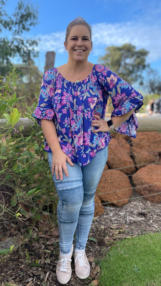 Add some vibrancy into your wardrobe with this stunning pink and blue floral design

Wear off the shoulder or as a standard neckline
Floaty, flattering sleeves
Gener - Zariah Off Shoulder Top - Dreamcatcher