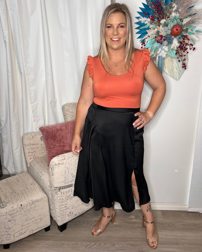 
This summer, we welcome the Naomi Frill Top, the perfect addition to your wardrobe. This top is made from cotton elastane jersey, which makes it soft and comfortabl - NEW Naomi Frill Top - Burnt Orange - Sass Clothing