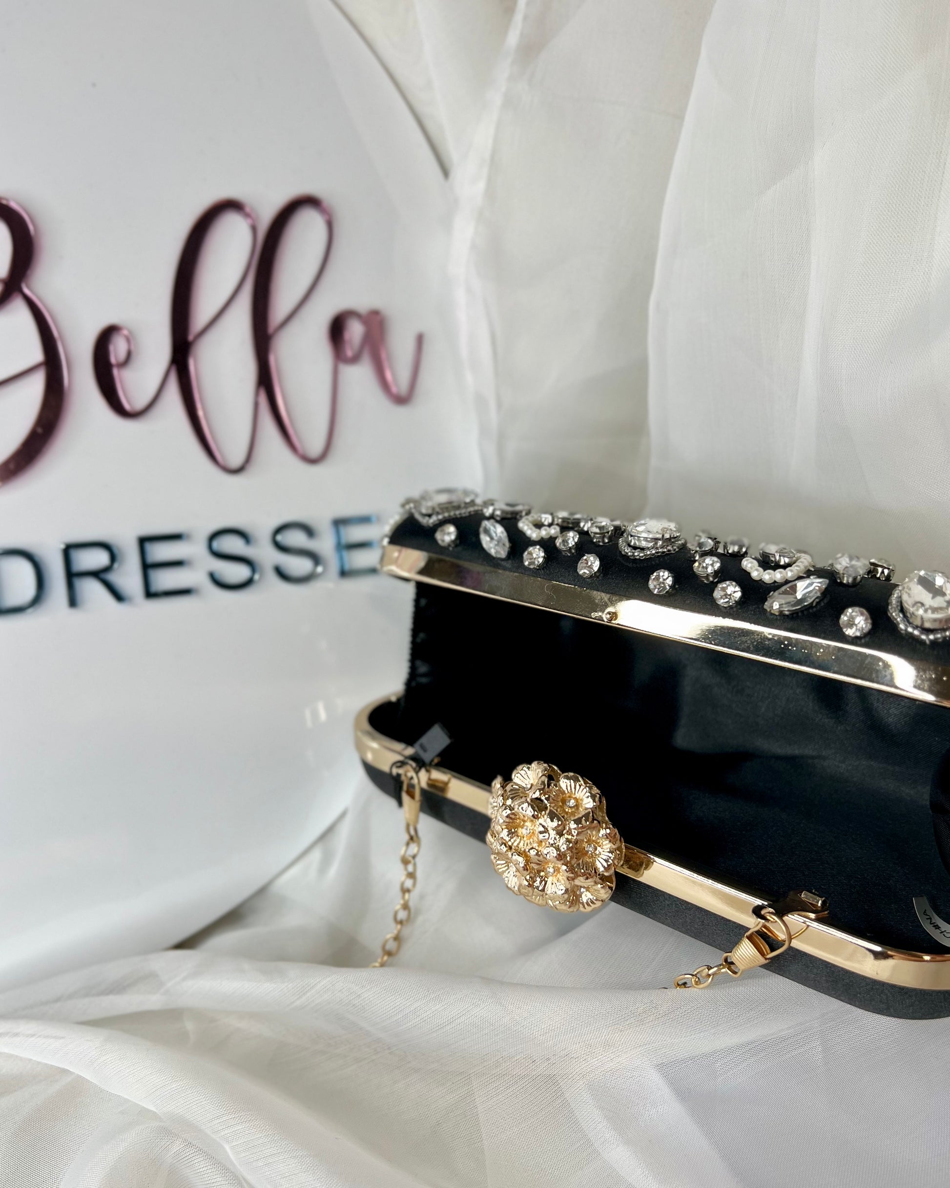 Elana Evening Bag: This stunning piece will bring together your evening outfit with it’s gorgeous pops of bling against a contrasting black satin background
Features:

Interchangable c - Ciao Bella Dresses 