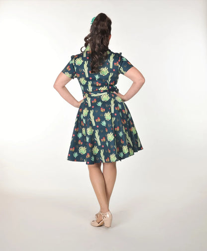 Betty Dress - Arizona Garden | Miss Molly M Designs | 
The Betty Dress features a fitted shirt waist bodice with 4 buttons, cinched waist, flared skirt, turn down collar, side pockets, fully lined bodice, short sleeves,