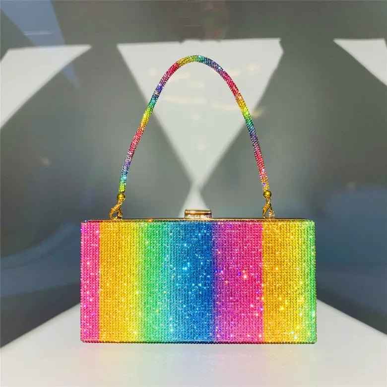 Alina Evening Bag: The Alina Evening Bag has all the colour and sparkle one could dream of. This bag will bring any outfit to life
Features:

Top clasp
Gorgeous block rainbow pattern
T - Ciao Bella Dresses 